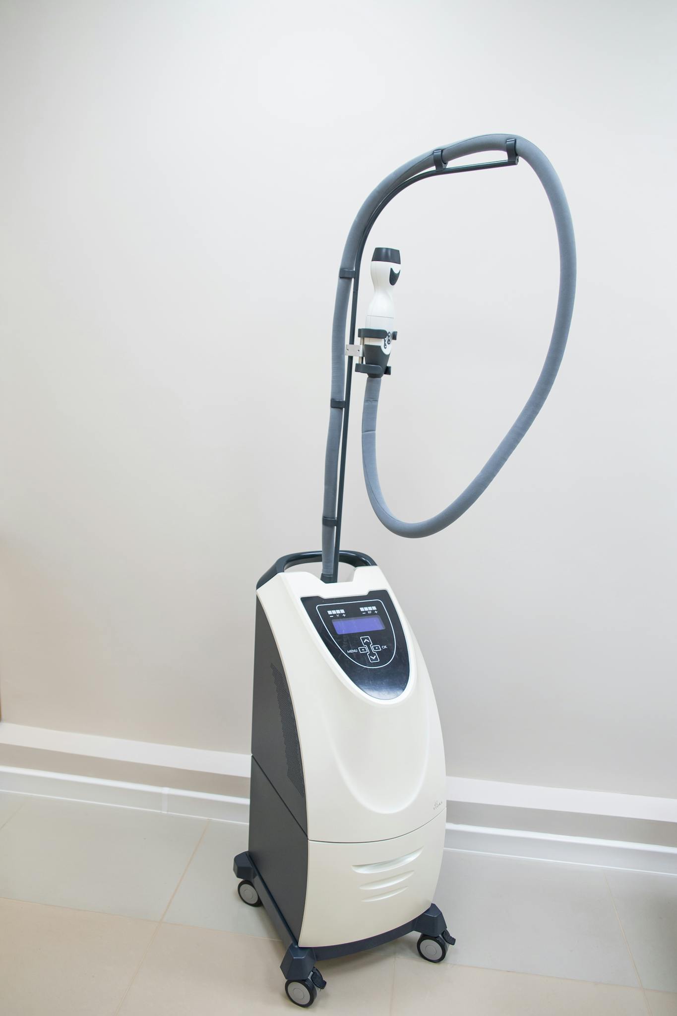 High-tech medical diagnostic machine in a sterile clinic environment.